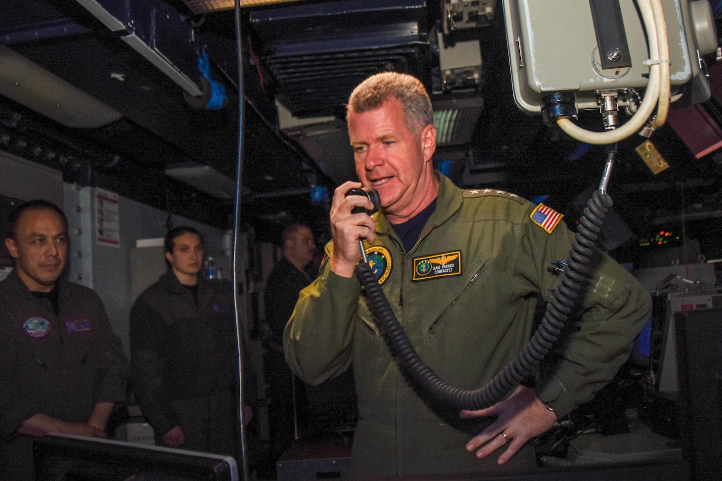 PHILIPPINE SEA (June 9, 2021) Adm. Samuel Paparo, commander, U.S. Pacific Fleet, addresses the crew of the U.S. Navy’s forward-deployed aircraft carrier, USS Ronald Reagan (CVN 76), from the combat direction center. During Paparo’s visit he attended meetings with warfare commanders and provided a message to the crew over the ship’s announcement system. Ronald Reagan, the flagship of Carrier Strike Group 5, provides a combat-ready force that protects and defends the United States, as well as the collective maritime interests of its allies and partners in the Indo-Pacific region. (U.S. Navy photo by Mass Communication Specialist Seaman Oswald Felix Jr.)