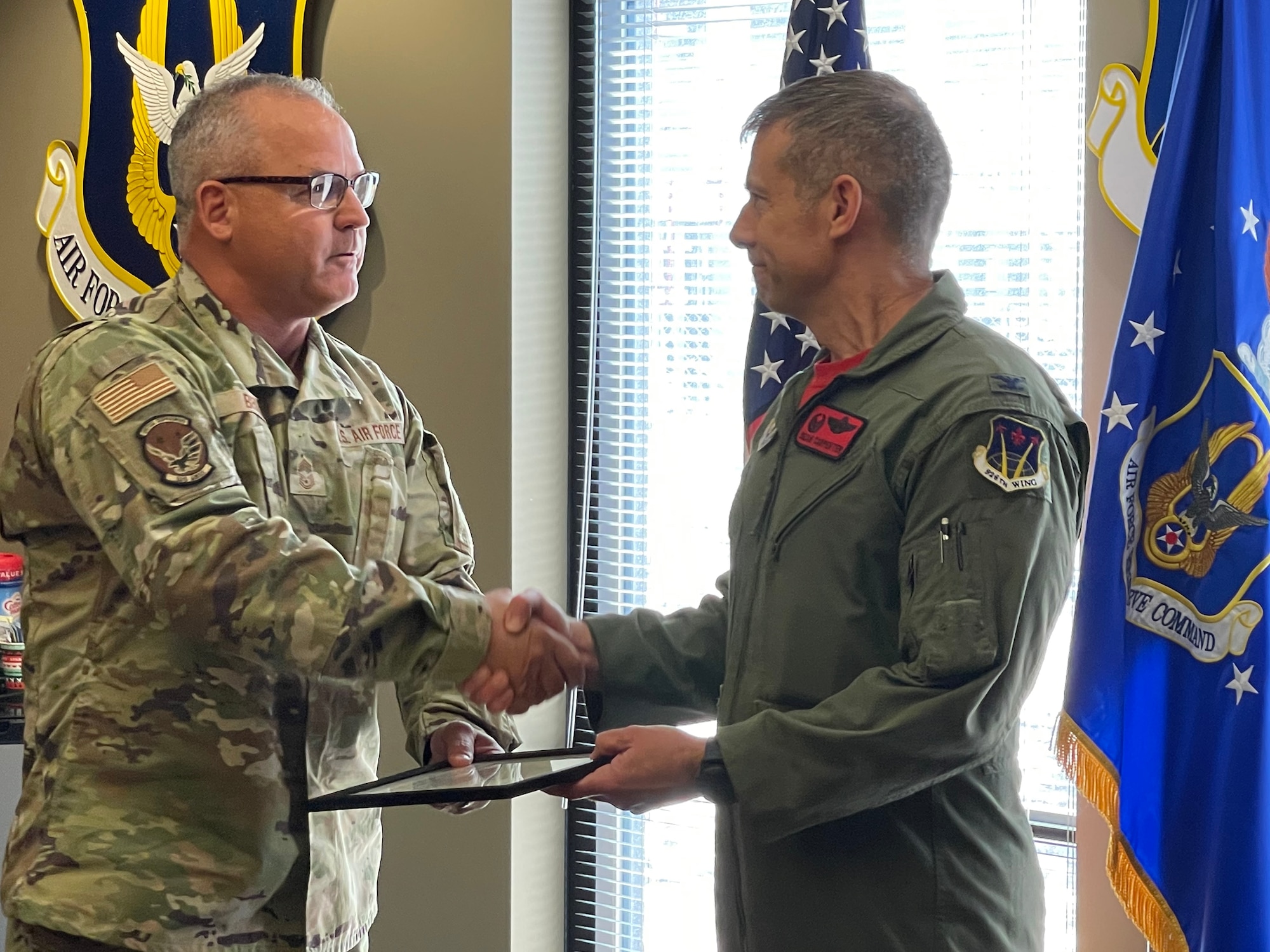 Chief Master Sgt. Michael Brunin, 926th Aircraft Maintenance Squadron superintendent, recognized Col. Sean Carpenter, 926th WG commander, as the wings newest chief master sergeant during a ceremony June 11, at Nellis Air Force Base, Nevada.