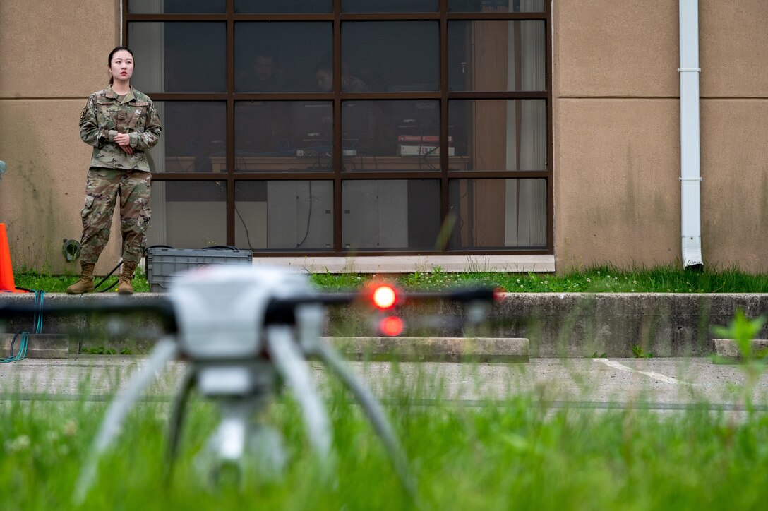 Senior Airman Clara Song, 51st Civil Engineer Squadron construction inspector, observes the takeoff of a small unmanned aircraft system at Osan Air Base, Republic of Korea, June 6, 2021. As a SUAS operator, Song must be proficient with operating the Aeryon SkyRanger system. (U.S. Air Force photo by Tech. Sgt. Nicholas Alder)