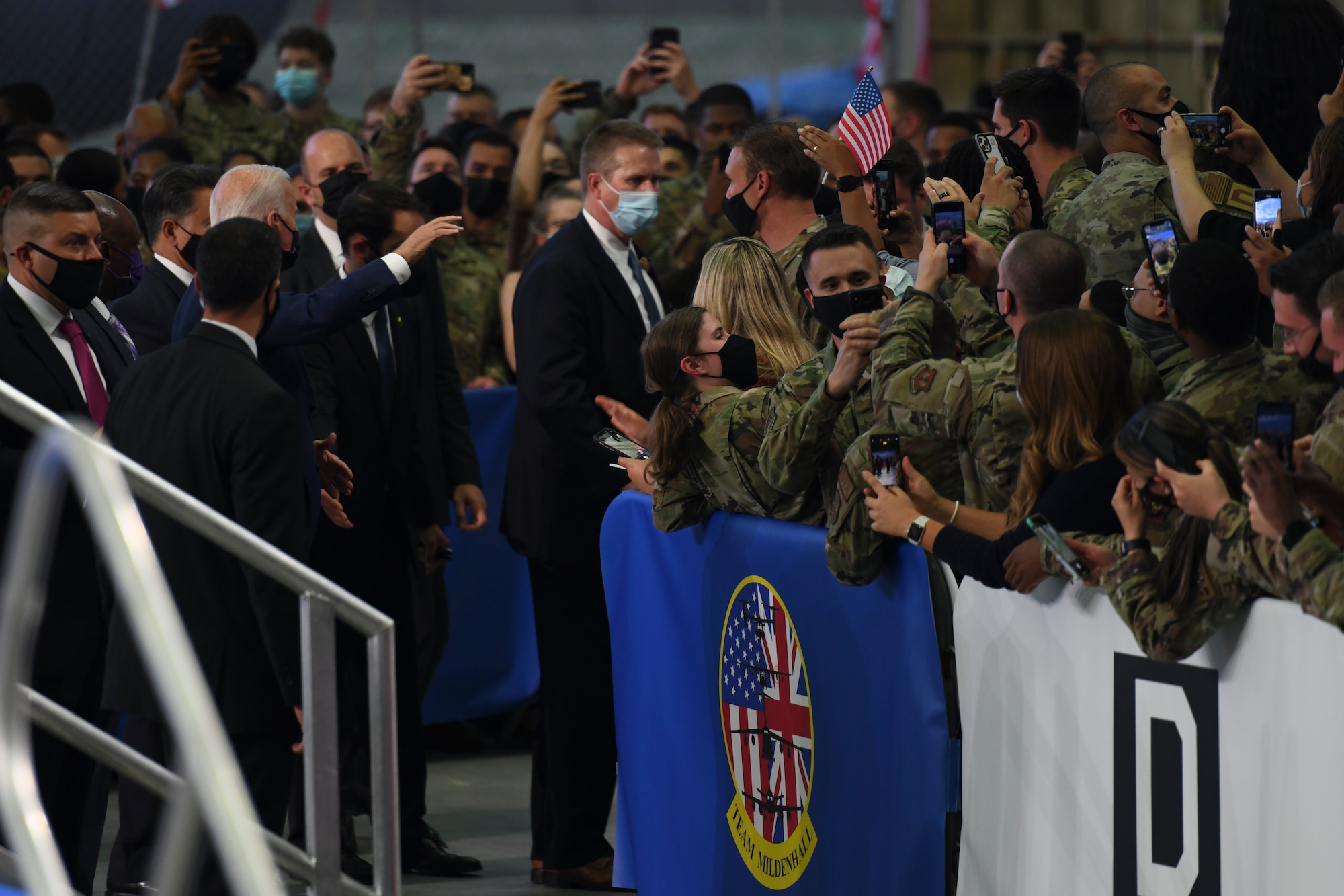 President Joe Biden waves to  members of the tri-base area at Royal Air Force Mildenhall, United Kingdom, June 4, 2021.