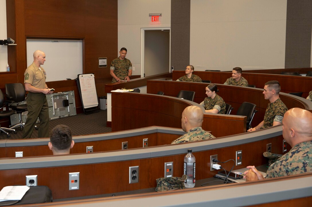 The 19th Sergeant Major of the Marine Corps, Sgt. Maj. Troy E. Black, addresses the members of the Sustaining the Transformation Writing Team at Marine Corps Base Quantico, Va, June 7, 2021. The Sergeant Major of the Marine Corps gave opening comments to the writing team as they work through what need to be included in future iterations. The goal is to develop the next version of Sustaining the Transformation that reflects the current state of the Marine Corps and transcends future generations. (U.S. Marine Corps photo by Sgt. Victoria Ross)