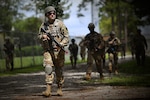 Staff Sgt. Jacob Tapley, 159th Civil Engineer Squadron, takes part in dismounted patrol tactics as part of basic combat skills training at the Air Dominance Center in Savannah, Ga., June 7, 2021. The training was led by the 159th Security Forces Squadron as part of unit operations readiness.