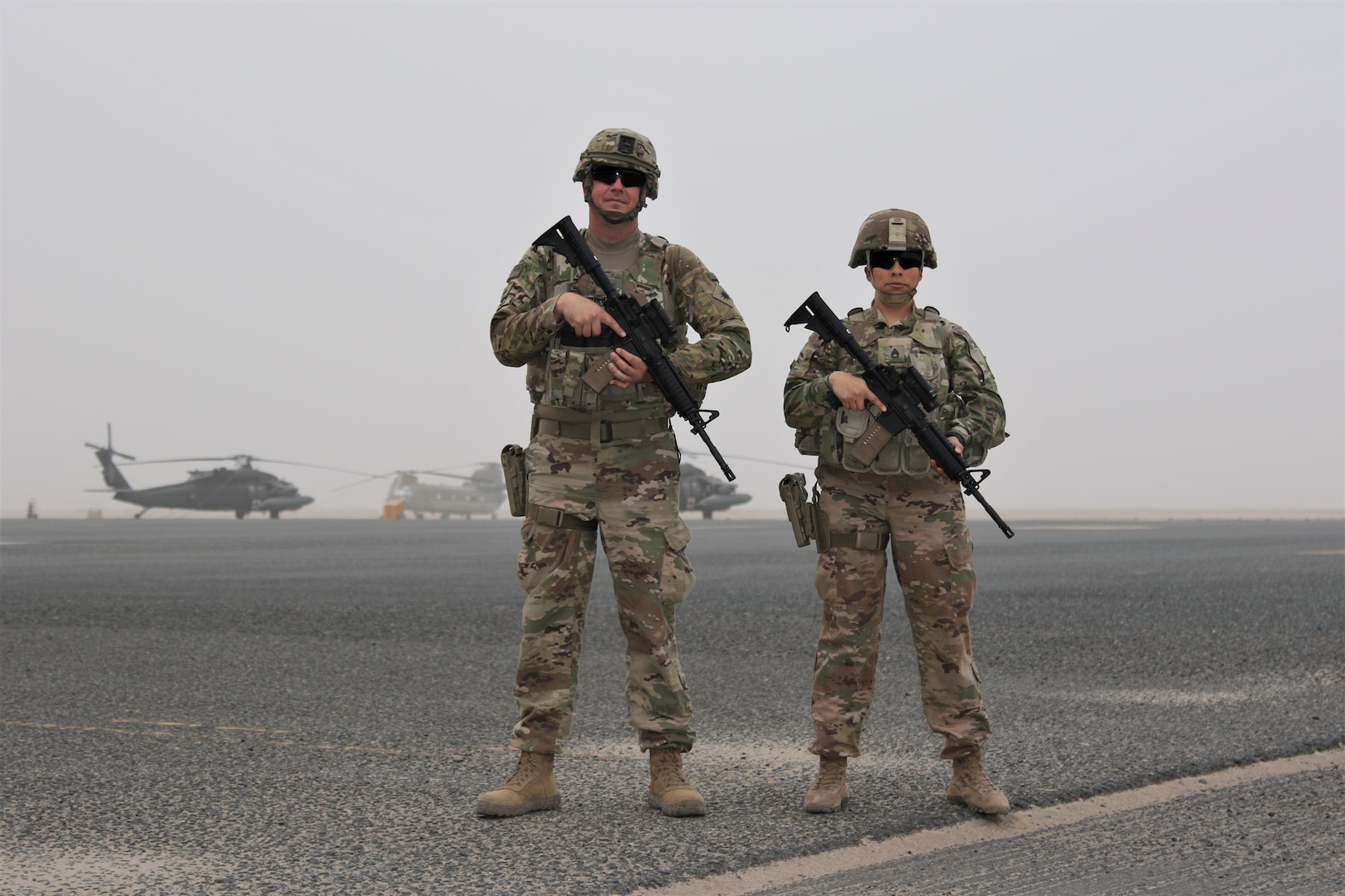 Sgt. Daniel Gunther and Staff Sgt. Cindy Gray at Camp Buehring, Kuwait. Gunther and Gray are California Army National Guard members deployed to the Middle East with Task Force Phoenix. On the civilian side, both are highway patrol officers with the California Highway Patrol (CHP).