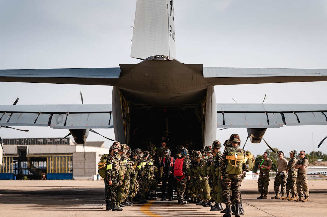 Royal Moroccan Air Force paratroopers load onto a U.S. C-130J Super Hercules aircraft assigned to the 37th Airlift Squadron, Ramstein Air Base, Germany, during Exercise African Lion 21 at the 3rd Royal Moroccan Air Force Base in Kenitra, Morocco, June 10, 2021.