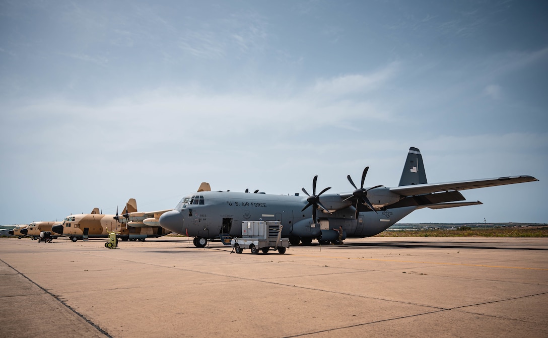 A U.S. C-130J Super Hercules aircraft assigned to the 37th Airlift Squadron, Ramstein Air Base, Germany soaks up the sun next to three Royal Moroccan Air Force C-130 Hercules aircraft during Exercise African Lion 21 at the 3rd Royal Moroccan Air Force Base in Kenitra, Morocco, June 10, 2021.