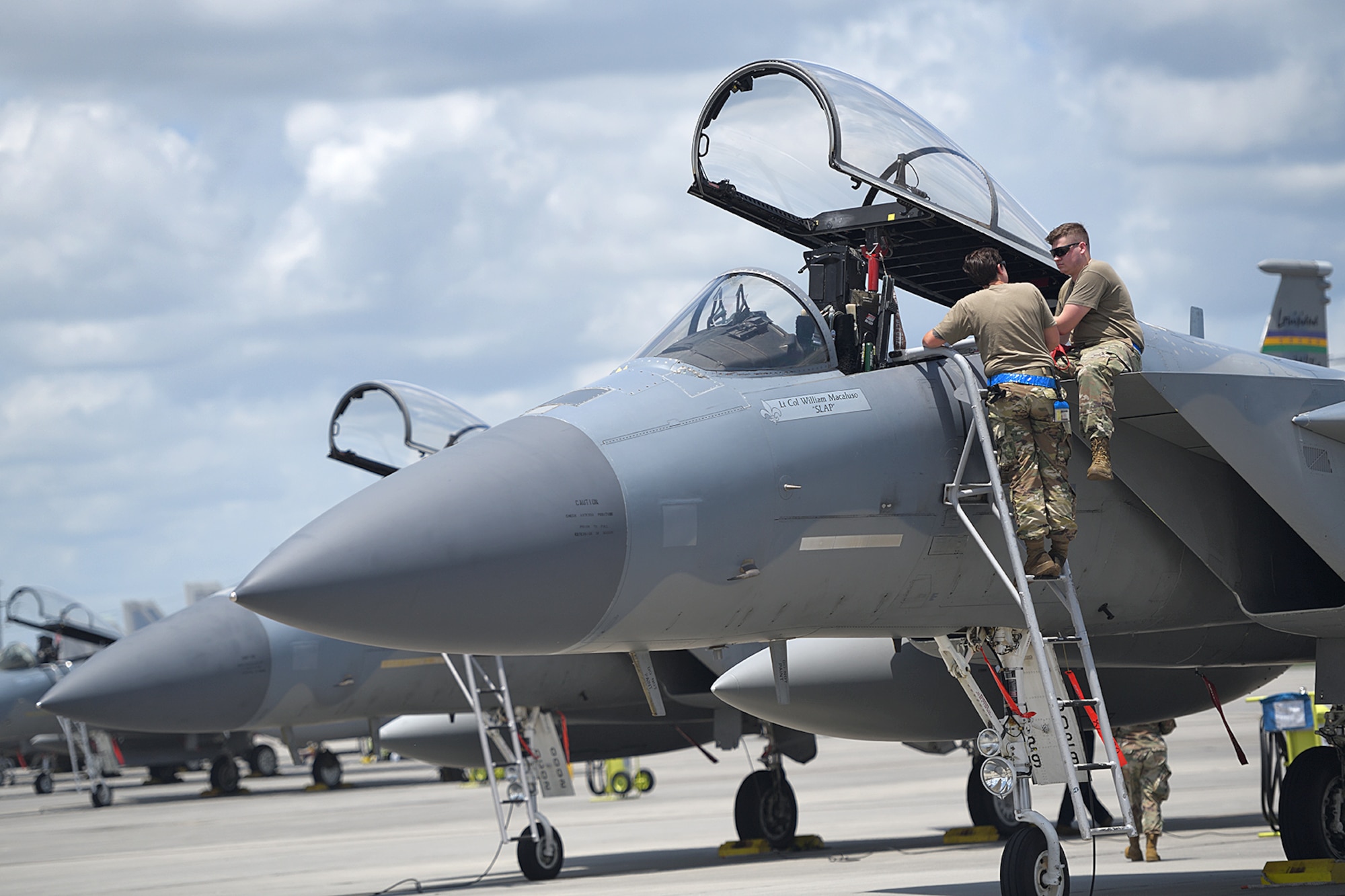 159th Maintenance Group crew chiefs inspect an F-15C in preparation for takeoff at the Air Dominance Center in Savannah, Ga., June 9, 2021. Six Louisiana Air National Guard F-15s deployed to the ADC to participate in dissimilar aircraft training, which allows pilots to hone their tactical skills with other combat airframes.