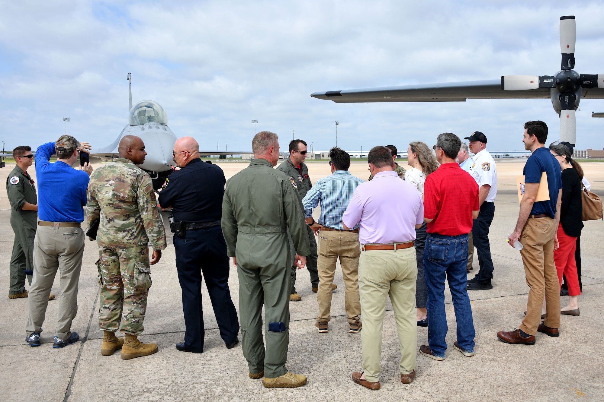 Civic leaders from the Dallas/Fort Worth area listen to (center) Col. Korey “Axe” Amundson, 301st Fighter Wing vice commander, share the 301 FW mission on June 11, 2021, at U.S. Naval Air Station Joint Reserve Base Fort Worth, Texas. The Civic Leader Day event hosted approximately 70 civilians to help them gain insight into the 301 FW's mission to train and deploy combat-ready Airmen. (U.S. Air Force photo by Staff Sgt. Randall Moose)