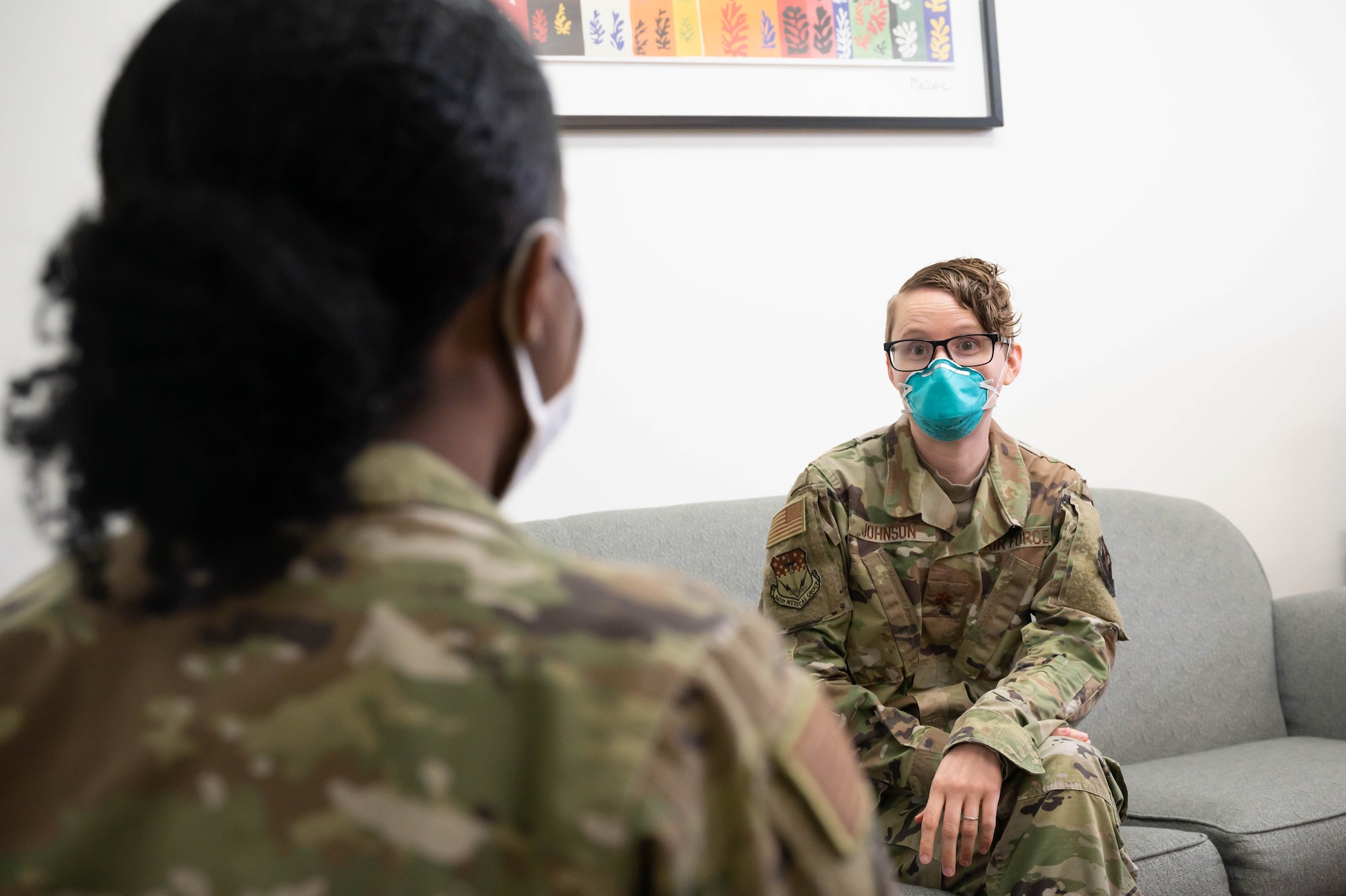 Maj. Laura Johnson, 341st Operational Medical Readiness Squadron mental health flight commander, speaks to an Airman in her office June 10, 2021, at Malmstrom Air Force Base, Mont.