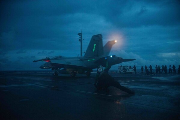 An F/A-18F Super Hornet attached to the Diamondbacks of Strike Fighter Squadron (VFA) 102 launches.