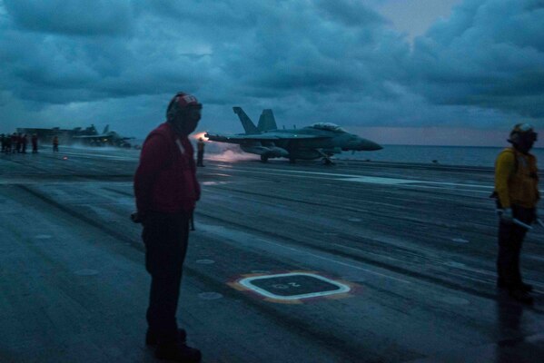 An EA-18G Growler attached to the Shadowhawks of Electronic Attack Squadron (VAQ) 141 launches.