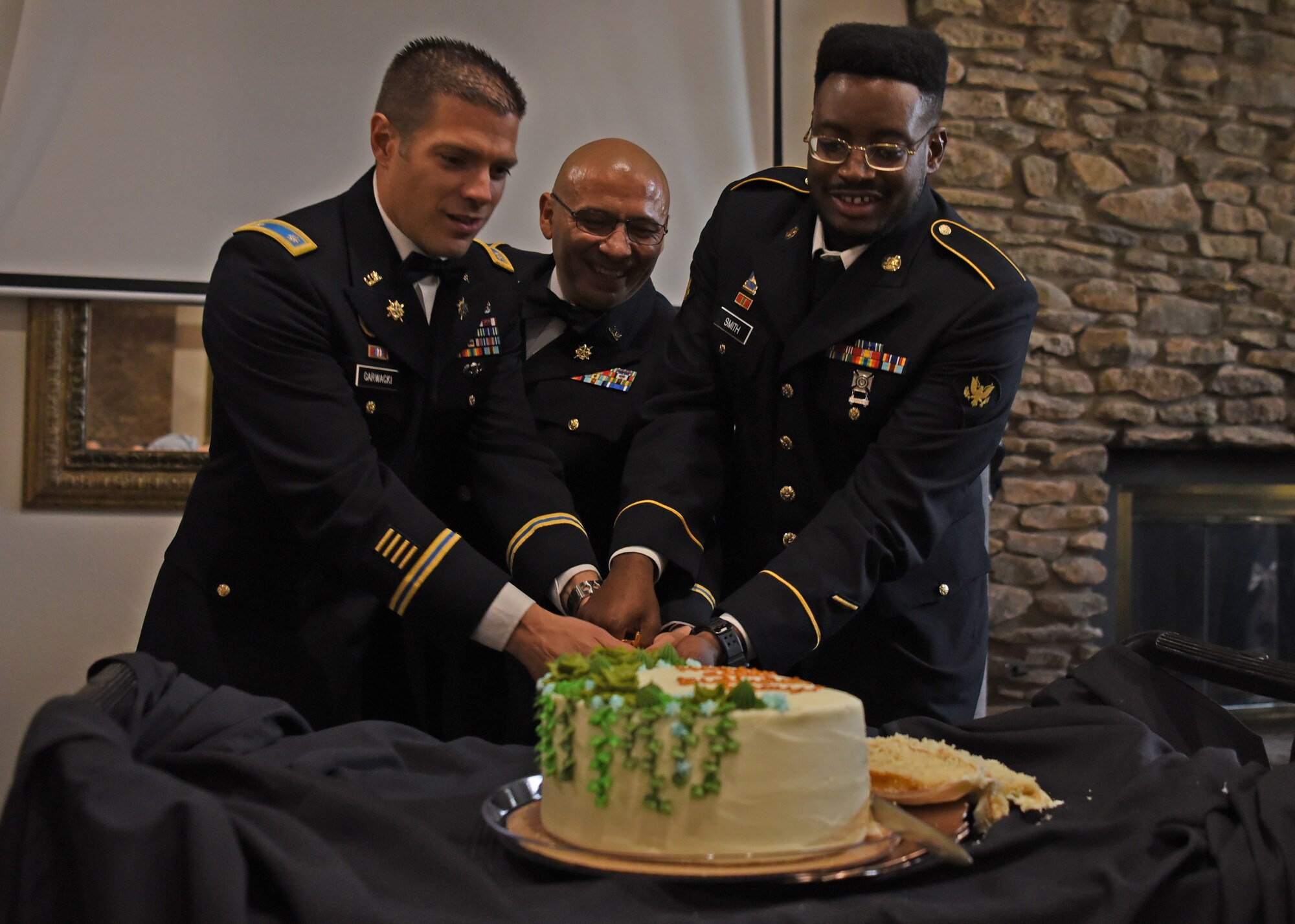 U.S. Army Lt. Col. Joseph Garwacki, 344th Military Intelligence Battalion commander, and Spc. Avion Smith, 344th MI BN student, cut the cake during the 246th Army Birthday Ball Restoration Celebration at the Bentwood Country Club in San Angelo, Texas, June 11, 2021. According to military customs, ceremonial cake cutting is traditionally done by the highest ranking individual and the lowest ranking individual in attendance.  (U.S. Air Force photo by Senior Airman Abbey Rieves)