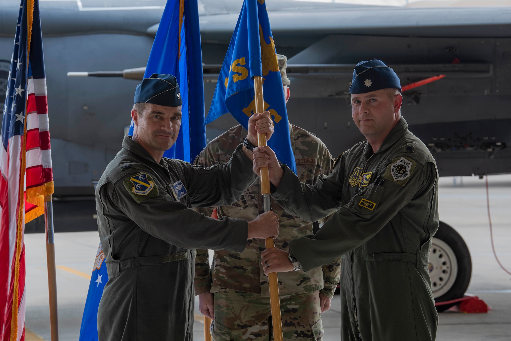 Lt. Col. Timothy Foery, right, outgoing 307th Fighter Squadron commander, passes the guidon to Col. Jason Reiss 414th Fighter Group commander, during the 307th FS change of command ceremony at Seymour Johnson Air Force Base, North Carolina, June 11, 2021.