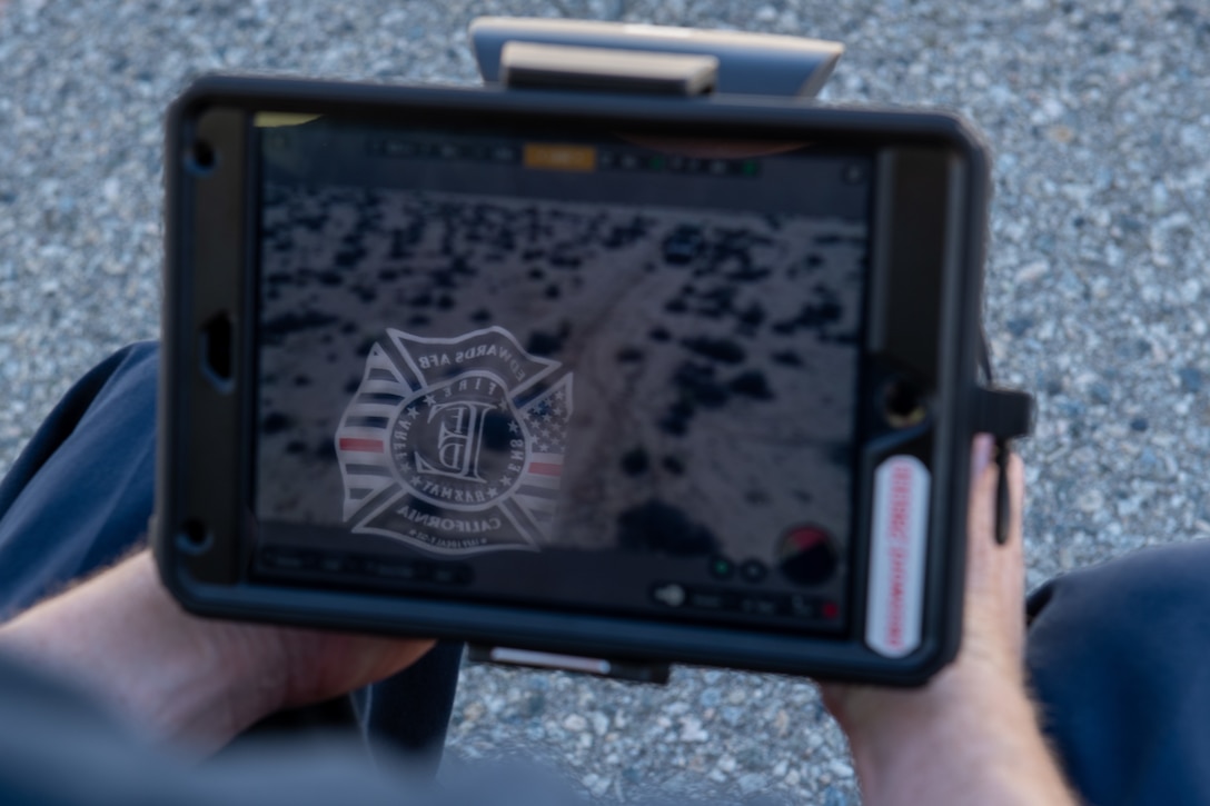 A digital tablet displays an image of an exercise scenario during an 812th Civil Engineering Squadron interoperability exercise on North Base at Edwards Air Force Base, California, June 4.