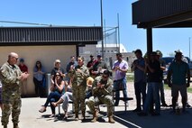 Members gather for comments at picnic