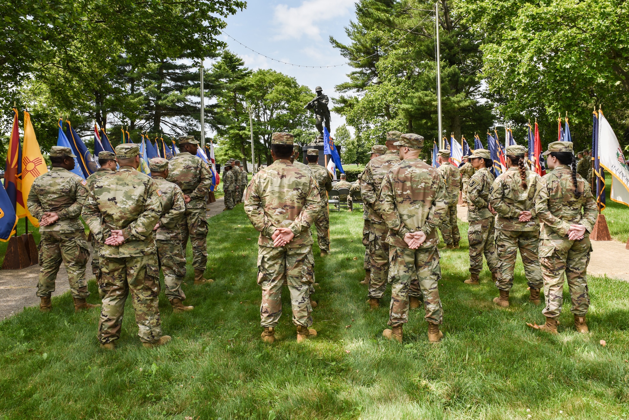 U.S. Army soldiers gather in front of the Ultimate Weapon Statue to celebrate the Army's 246th birthday at Joint Base McGuire-Dix-Lakehurst, N.J., June 14, 2021. The monument is an ode to the dedication and sacrifice of the Soldier. (U.S. Air Force Photo by Senior Airman Shay Stuart)