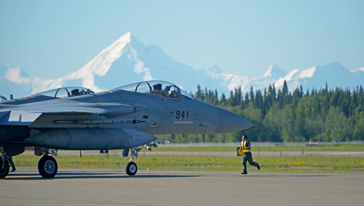 A Koku Jieitai (Japan Air Self-Defense Force) Airman conducts a pre-flight inspection of an F-15J Eagle during RED FLAG-Alaska 21-2 on Eielson Air Force Base, Alaska, June 14, 2021.
