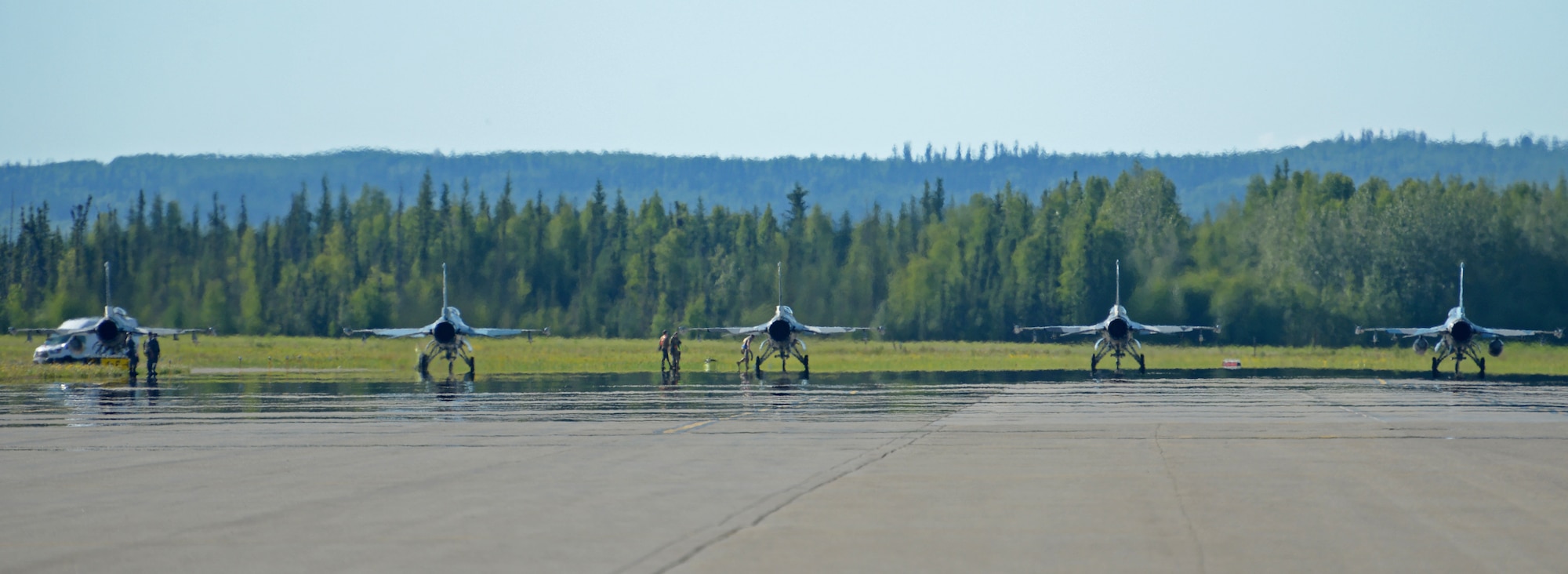 Multiple F-16 Fighting Falcons assigned to the 18th Aggressor Squadron prepare to launch during RED FLAG-Alaska on Eielson Air Force Base, Alaska, June 14, 2021.
