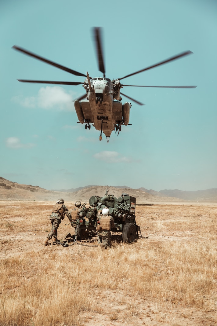 U.S. Marines with 1st Landing Support Battalion conduct an external lift of a bulk fuel pump.