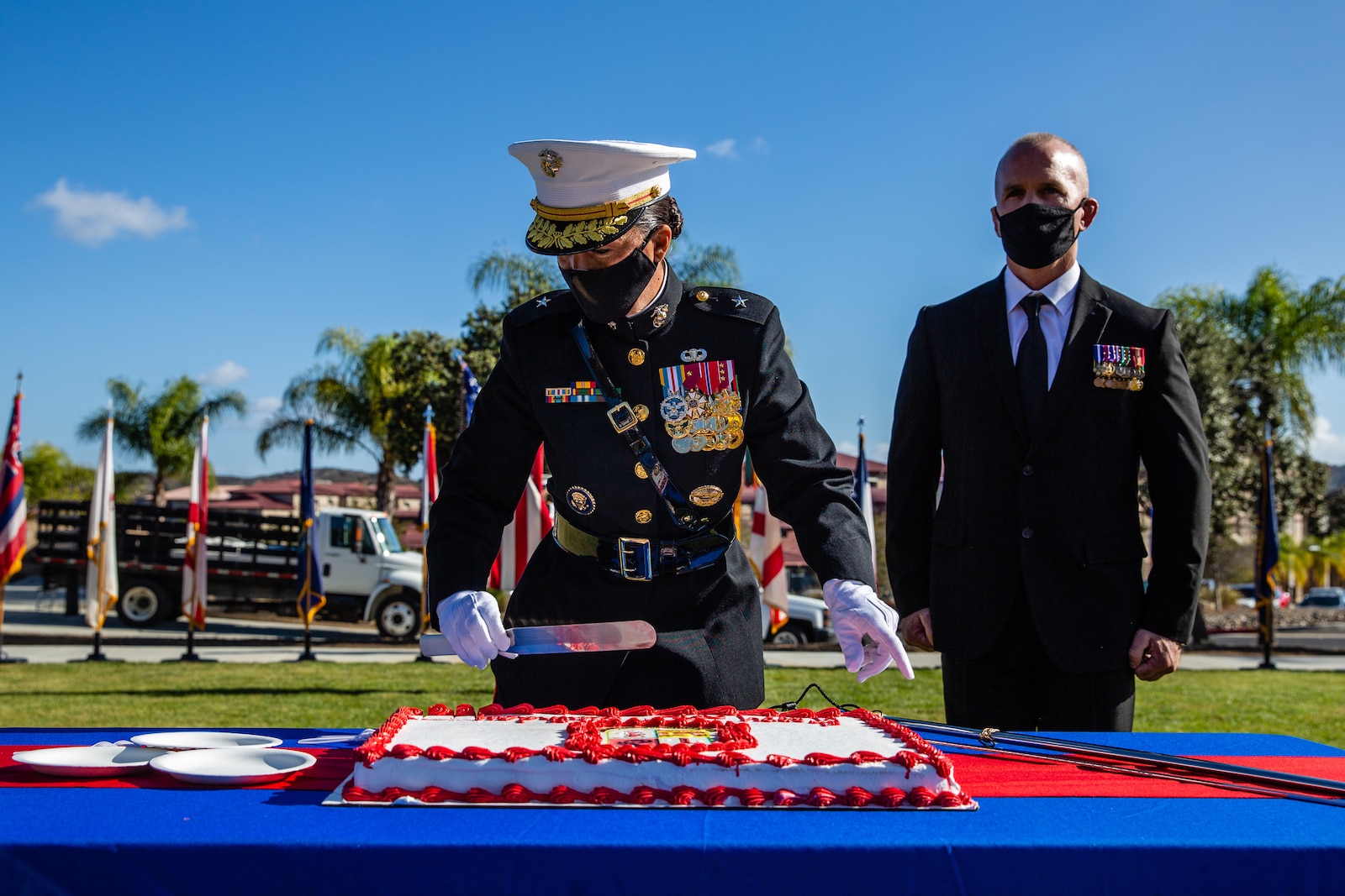 U.S. Marine Brig. Gen Bobbi Shea begins the passing of the cake during the unit’s cake cutting ceremony