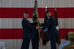 U.S. Space Force Lt. Gen. Stephen Whiting, Space Operations Command commander, left, passes the Space Delta 2 guidon to U.S. Space Force Col. Mark Brock at a change of command ceremony at Peterson Air Force Base, Colorado, June 14, 2021.