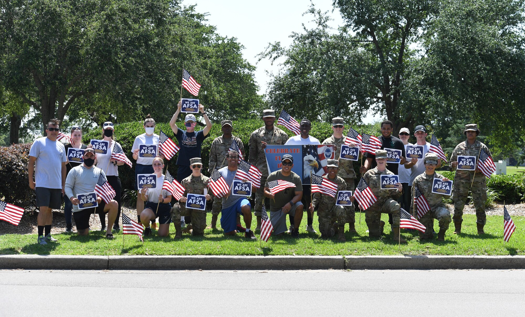 Members of the Air Force Sergeants Association Chapter 652 pose for a photo prior to placing U.S. flags in the ground along Larcher Blvd. at Keesler Air Force Base, Mississippi, June 11, 2021. June 14 is Flag Day, a celebration of the history of the American flag and a time to remember proper etiquette for its display. Flag Day recognizes the adoption of the Stars and Stripes as the official flag of the United States 238 years ago on June 14, 1777, by the Continental Congress meeting in Philadelphia. (U.S. Air Force photo by Kemberly Groue)