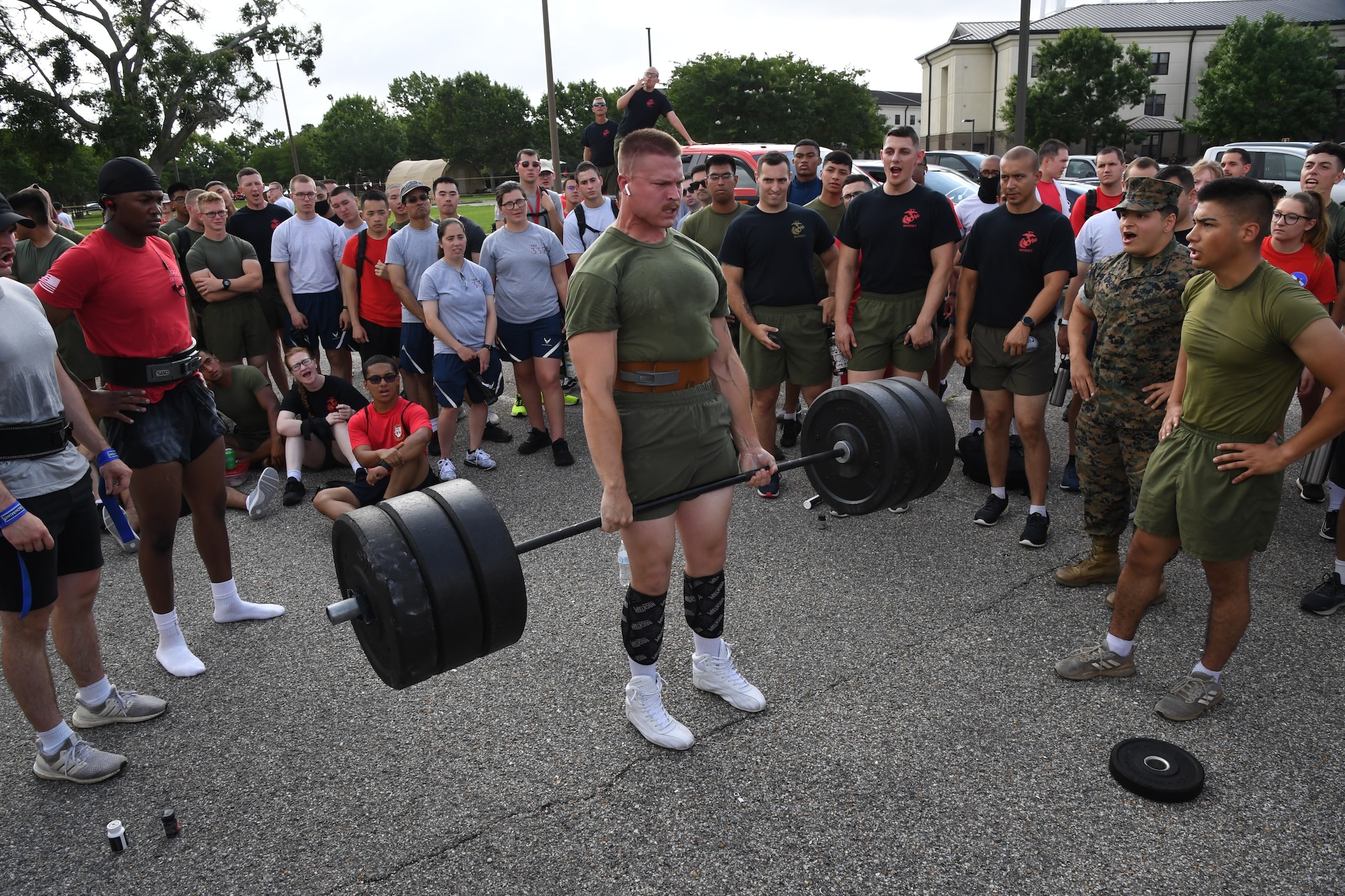 U.S. Marine Lance Corporal Jordan Coon, Keesler Marine Detachment student, participates in dead lift during the 81st Training Group Olympics at Keesler Air Force Base, Mississippi, June 11, 2021. The event also included competitions in long jump, track, shot put and discus. (U.S. Air Force photo by Kemberly Groue)