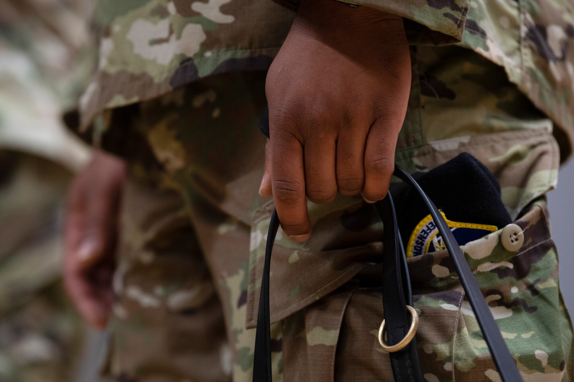 U.S. Air Force 52nd Security Forces Squadron kennel master, holds a military working dog leash.