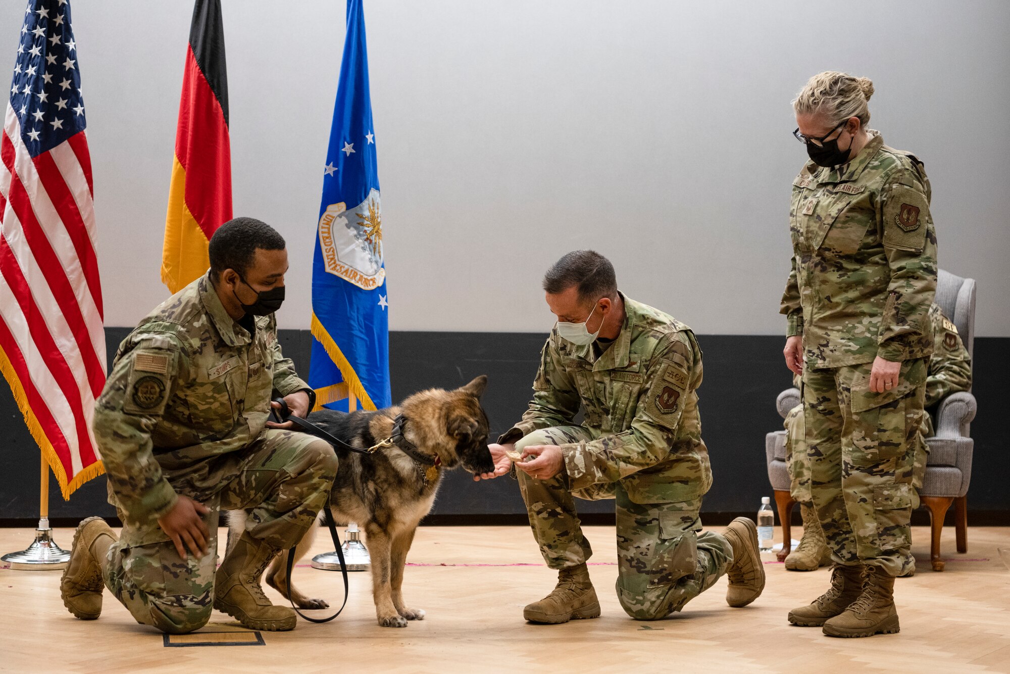 Spangdahlem command team gives a treat to retiring military working dog.