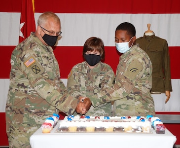 New York Army National Guard Chief Warrant Officer 4 Brian Sherman, Chief Warrant Officer Jacqueline O'Keefe, the New York National Guard Command Chief Warrant Officer, and Pfc. Tyler Tomlin cut a cake to celebrate the 246th birthday of the U.S. Army June 14, 2021, during a ceremony at New York Army National Guard headquarters in Latham, New York.