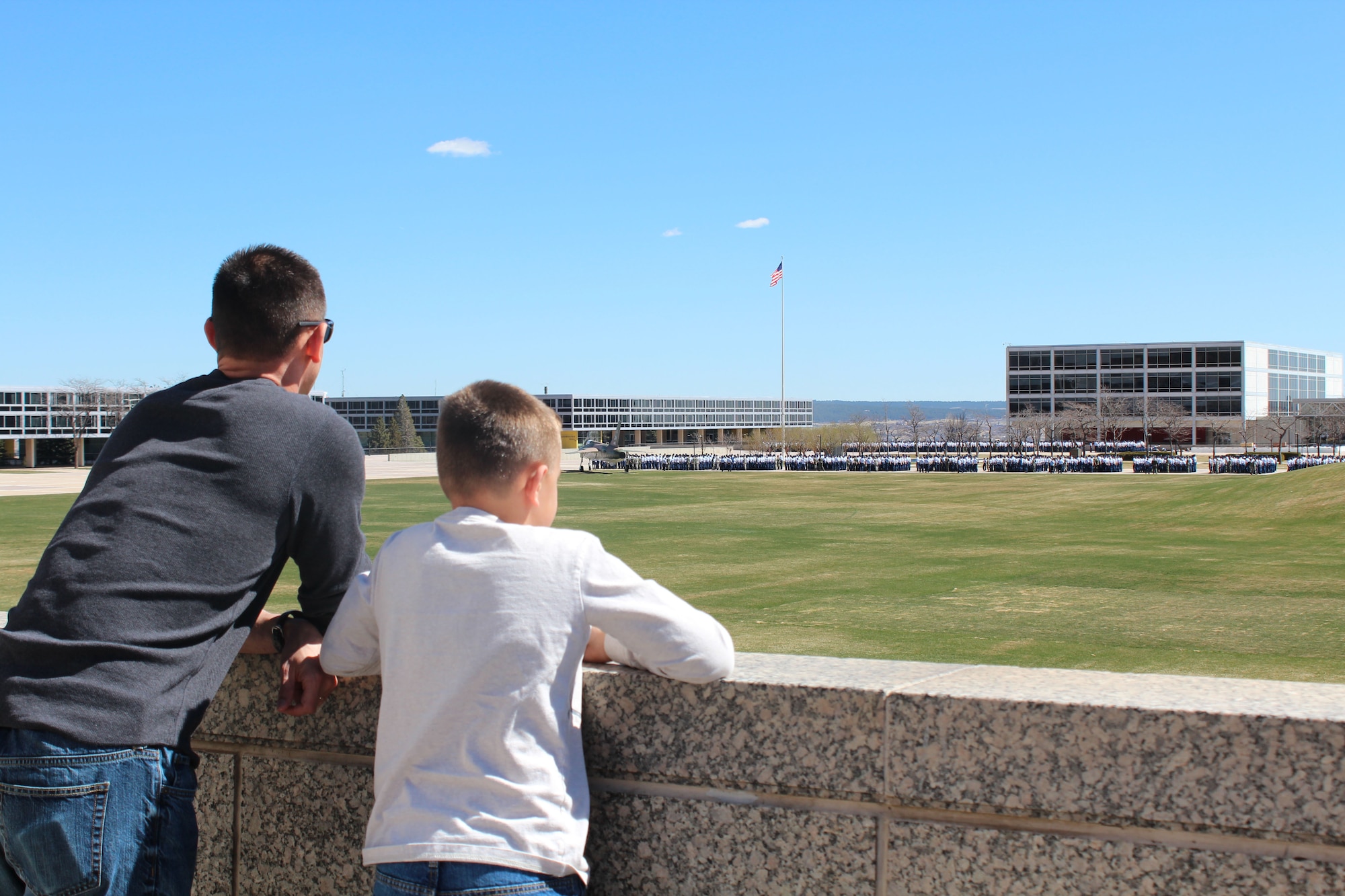 Col. Stuart Rubio, 403rd Wing commander, and his son Ashton look out over a parade field during a visit to the U.S. Air Force Academy in Colorado in 2015. Ashton, now 18, departs to start his first year at the Academy and is scheduled to graduate in the class of 2025. Rubio and his wife Megan both graduated from the Academy. (U.S. Air Force courtesy photo)