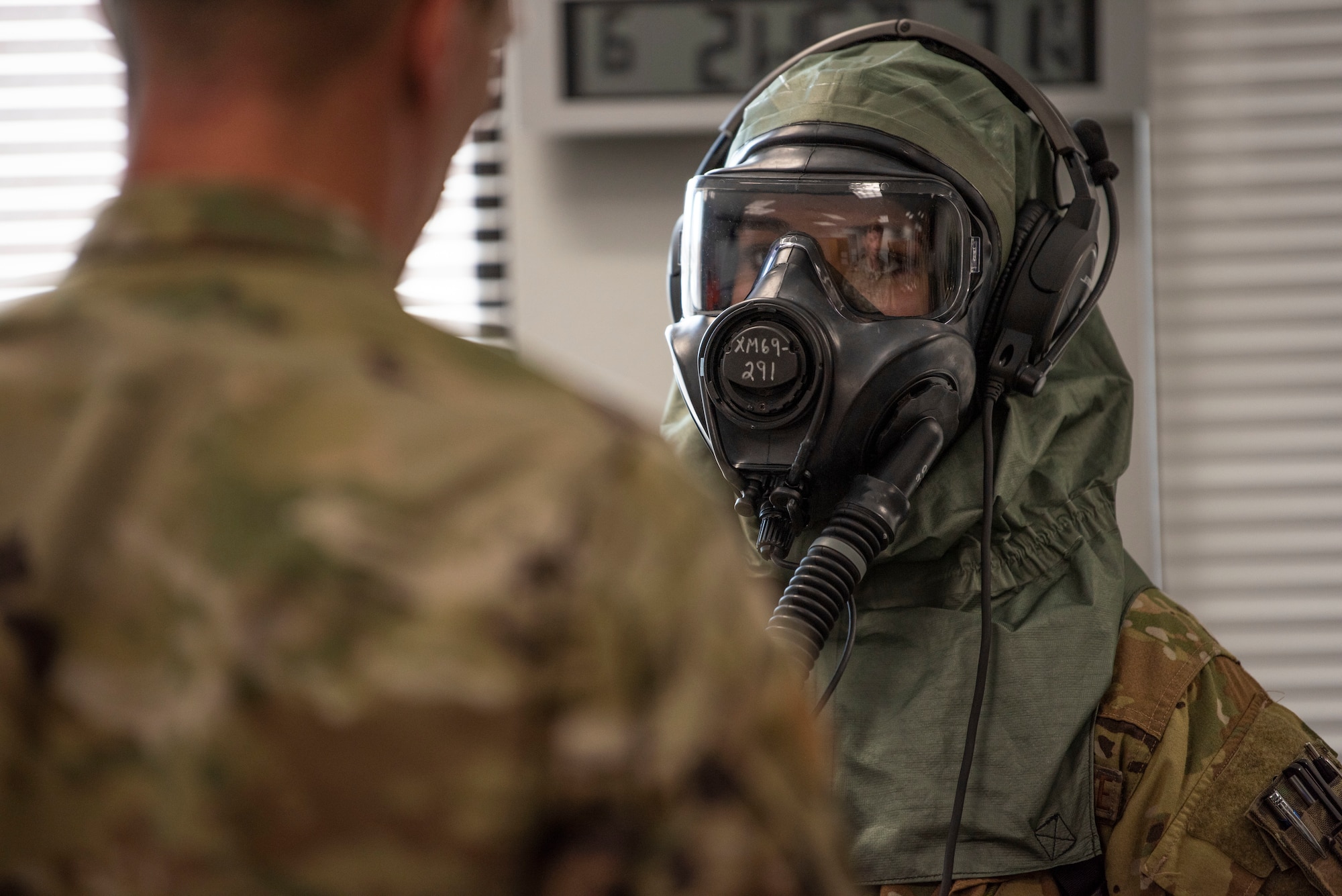 Capt. Miranda Mila, 40th Airlift Squadron pilot, tests a gas mask at Dyess Air Force Base, Texas, June 2, 2021. C-130J Super Hercules aircrew assisted in the research and development testing of the new Two-Piece Undergarment universal integrative ensemble chemical, biological, radioactive and nuclear protective equipment. (U.S. Air Force photo by Airman 1st Class Colin Hollowell)