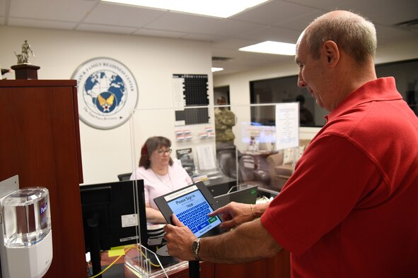 Paul D’Addario, 66th Force Support Squadron Friends of Family Services chairman, checks in to the Airman and Family and Readiness Center at Hanscom Air Force Base, Mass., June 10.  The A&FRC has reopened for in-person services in conjunction with online services. (U.S. Air Force photo by Linda LaBonte Britt)