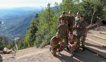 The seven Soldiers who competed in the annual U.S. Army Space and Missile Defense Command Best Warrior Competition stand atop the Manitou Incline in Colorado Springs, Colorado, June 10, 2021. The Soldiers partook in a four-day series of strenuous events to test their physical abilities and Army skills. (U.S. Army National Guard photo by Staff Sgt. Zach Sheely)