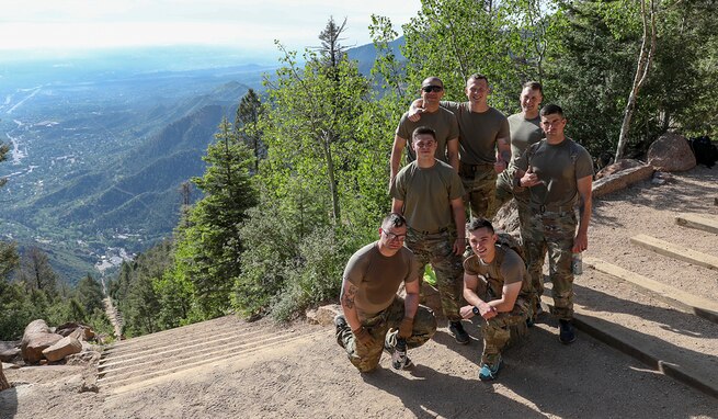 The seven Soldiers who competed in the annual U.S. Army Space and Missile Defense Command Best Warrior Competition stand atop the Manitou Incline in Colorado Springs, Colorado, June 10, 2021. The Soldiers partook in a four-day series of strenuous events to test their physical abilities and Army skills. (U.S. Army National Guard photo by Staff Sgt. Zach Sheely)
