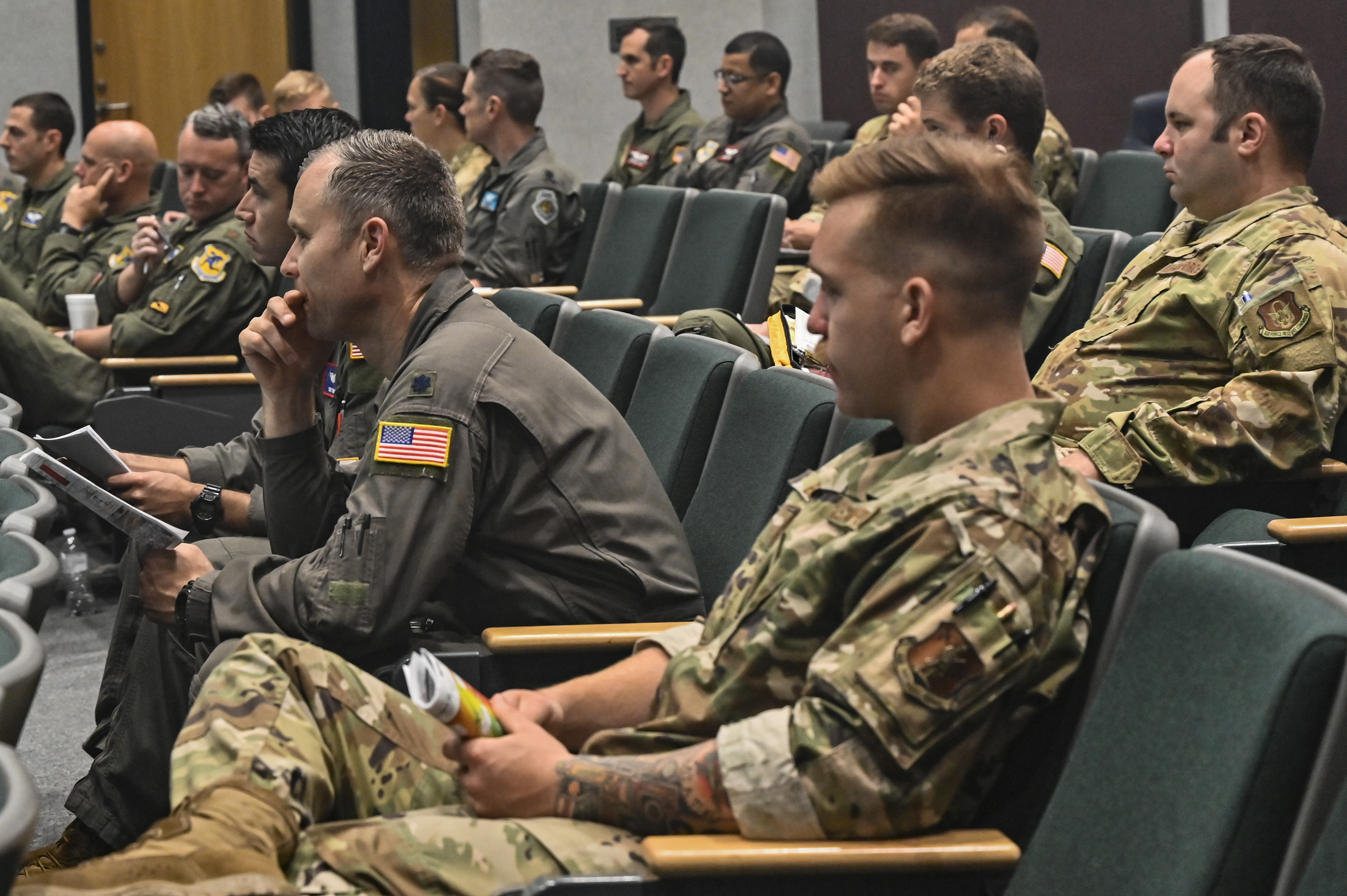 Dozens of C-130 pilots from the Air Mobility Command are briefed on the daily mission during their class 21A Weapons Instructor Course culmination exercise at Dyess Air Force Base, Texas, June 5, 2021. After several months of training, pilots were given the chance to coordinate and execute combat operations with over 25 airframes to include F-16 Fighting Falcons, F-15 Strike Eagles, C-17’s Globemasters and aerial support airframes. (U.S. Air Force photo by Tech. Sgt. Alexandre Montes)