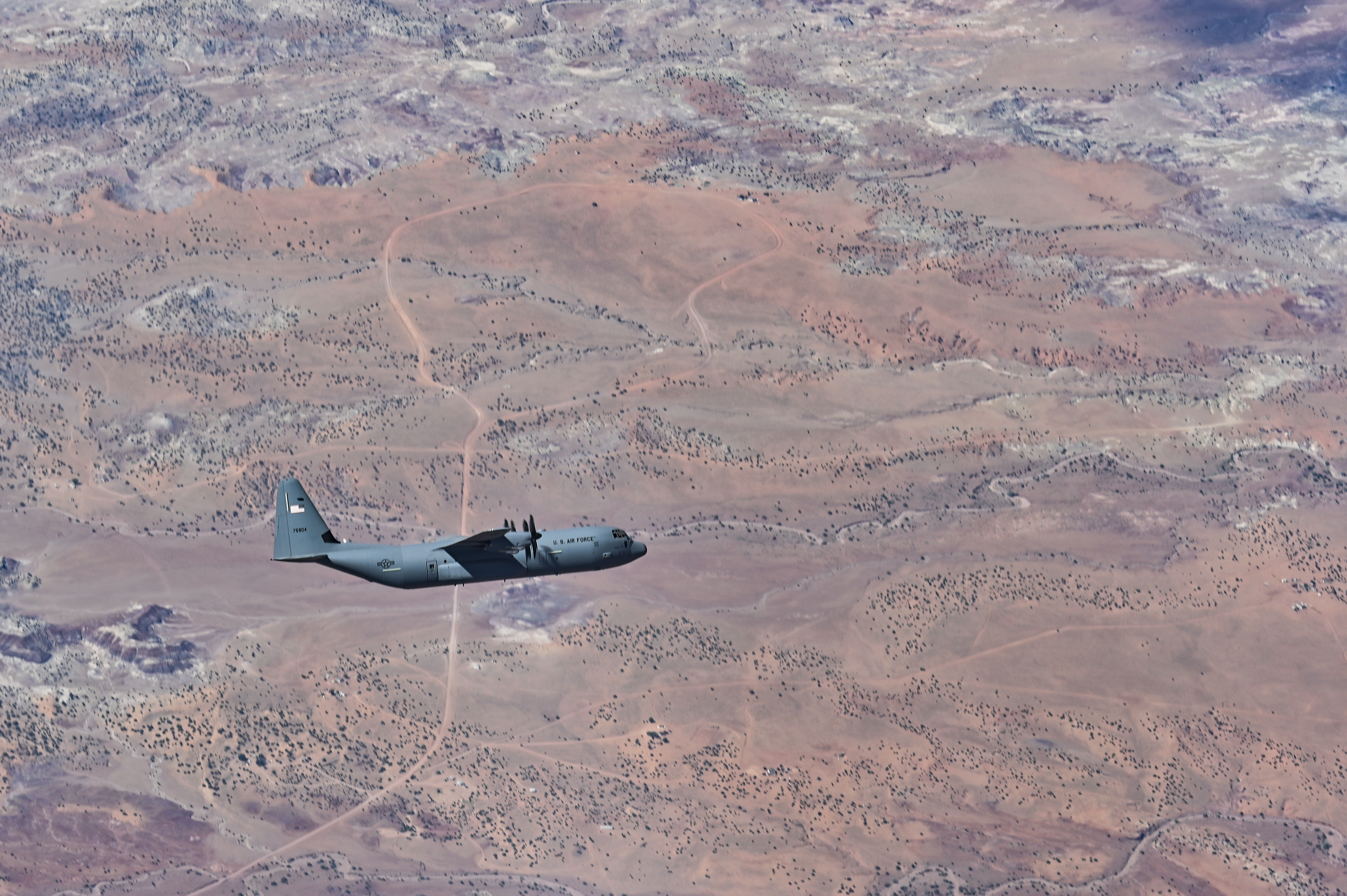 Several C-130s fly in formation during a training exercise for class 21A Weapons Instructor Course at Dyess Air Force Base, Texas, June 5, 2021. Both C-130H and C-130J models were launched and conducted combat aerial support after months of training and plaining from the pilot students. (U.S. Air Force photo by Tech. Sgt. Alexandre Montes)