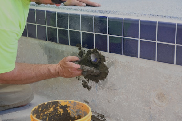 Man repairs pool