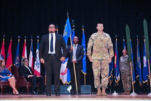 Miguel Capellan, 733rd Civil Engineer Squadron director, and U.S. Army Col. Chesley Thigpen, 733rd Mission Support Group commander, pose for a picture at Joint-Base Langley-Eustis, Virginia, June 15, 2021. During a 733rd Squadron Activation ceremony, the 733rd CES was officially activated to provide streamlined support for mission partners at JBLE. (U.S. Air Force photo by Senior Airman John Foister)