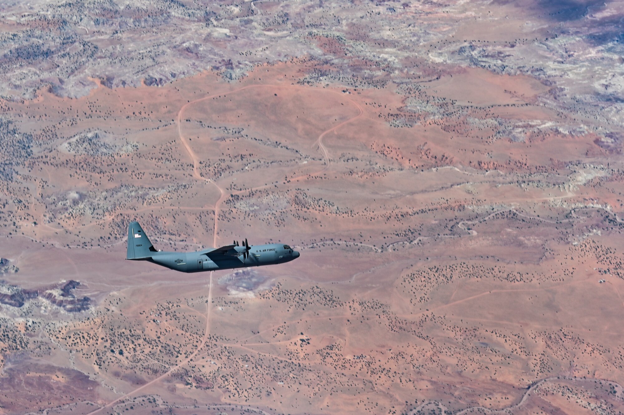 C-130 flying over desert