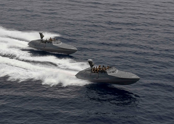 Two combatant craft assault crafts (CCA) perform a high-speed pass alongside the Expeditionary Sea Base USS Hershel "Woody" Williams (ESB 4) in the Mediterranean Sea, May 26, 2021.