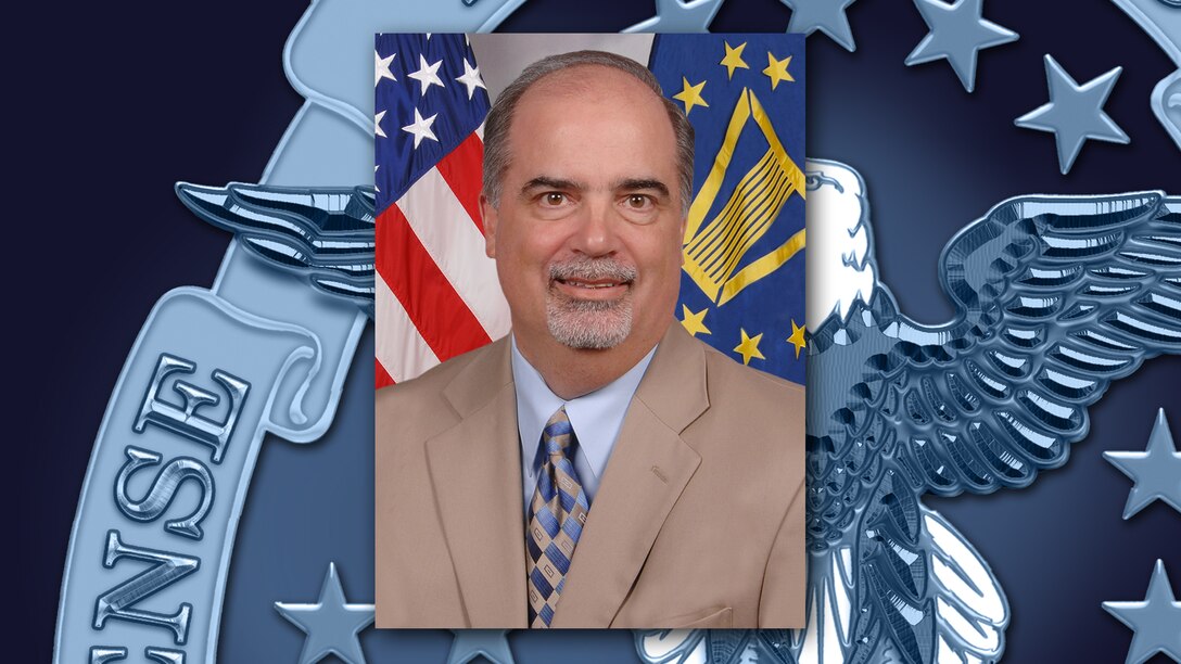 A portrait of Tony Poleo on a background featuring a portion of the DLA emblem