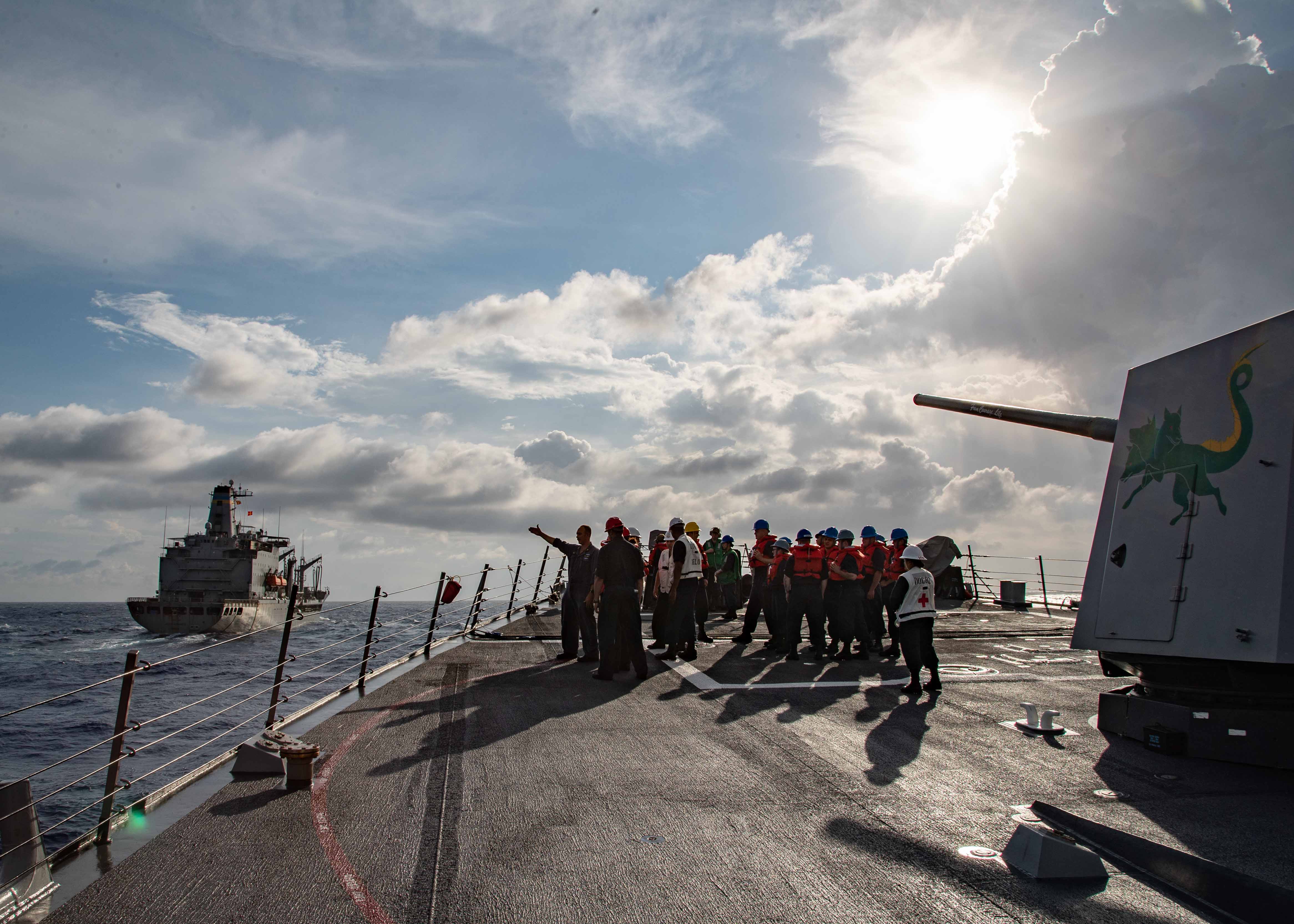 Sailors assigned to the Arleigh Burke-class guided missile destroyer USS Lassen (DDG 82) prepare for a replenishment-at-sea with USNS Joshua Humphreys (T-AO-188), June 12, 2021.