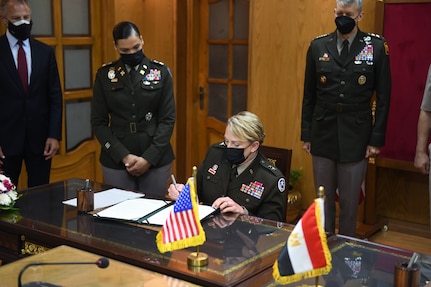 Army Maj. Gen. Tracy Norris, adjutant general, Texas National Guard, signs a document formalizing the pairing of Egypt and the Texas National Guard in the Department of Defense National Guard State Partnership Program, Cairo, Egypt, June 14, 2021.