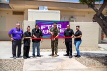Marine Corps Air Station Yuma Commanding Officer, Col Charles E. Dudik, alongside MCCS personnel, cuts the ribbon in honor of the official opening of the Afterburner restaurant aboard MCAS Yuma, Ariz., June 10, 2021. The Afterburner is open Monday through Friday 0700 - 1300 serving Marines and civilians a variety of burritos, sandwiches and bowls. (U.S. Marine Corps photo by Lance Cpl. Gabrielle Sanders)