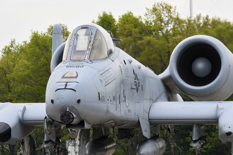A photo of the front of an aircraft on the flight line