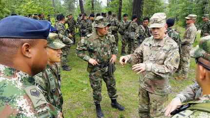 aj. Gen. Daniel R. Walrath, right, U.S. Army South commanding general, greets Colombian soldiers during a visit to the Joint Readiness Training Center at Fort Polk, La., June 9, 2021. The Colombian Army is the second South American army to conduct bilateral training with a U.S. Army unit as part of a JRTC rotation.