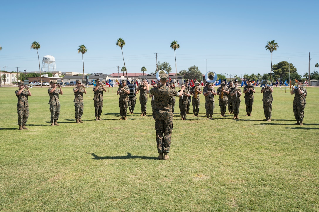 U.S. Marine Corps Staff Sgt. John Geary conducts the 3rd Marine Aircraft Wing Band during a change of command ceremony on Marine Corps Air Station Yuma, June 8, 2021.