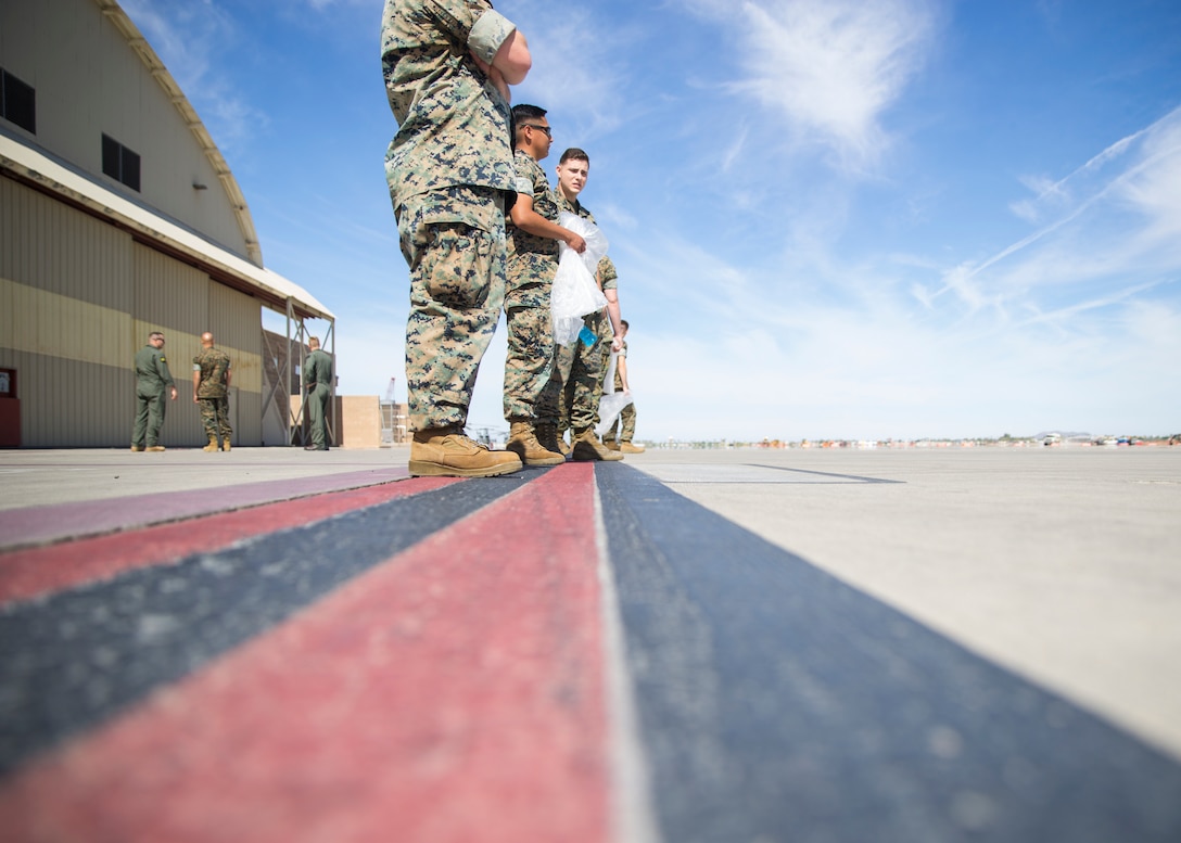U.S. Marines line up before conducting an Foreign Object Debris (FOD) walk at Marine Corps Air Station Yuma, Ariz., June 7, 2021. A FOD walk is conducted routinely to ensure runways are clear from debris that may damage aircraft using it. (U.S. Marine Corps Photo by Lance Cpl Matthew Romonoyske-Bean)