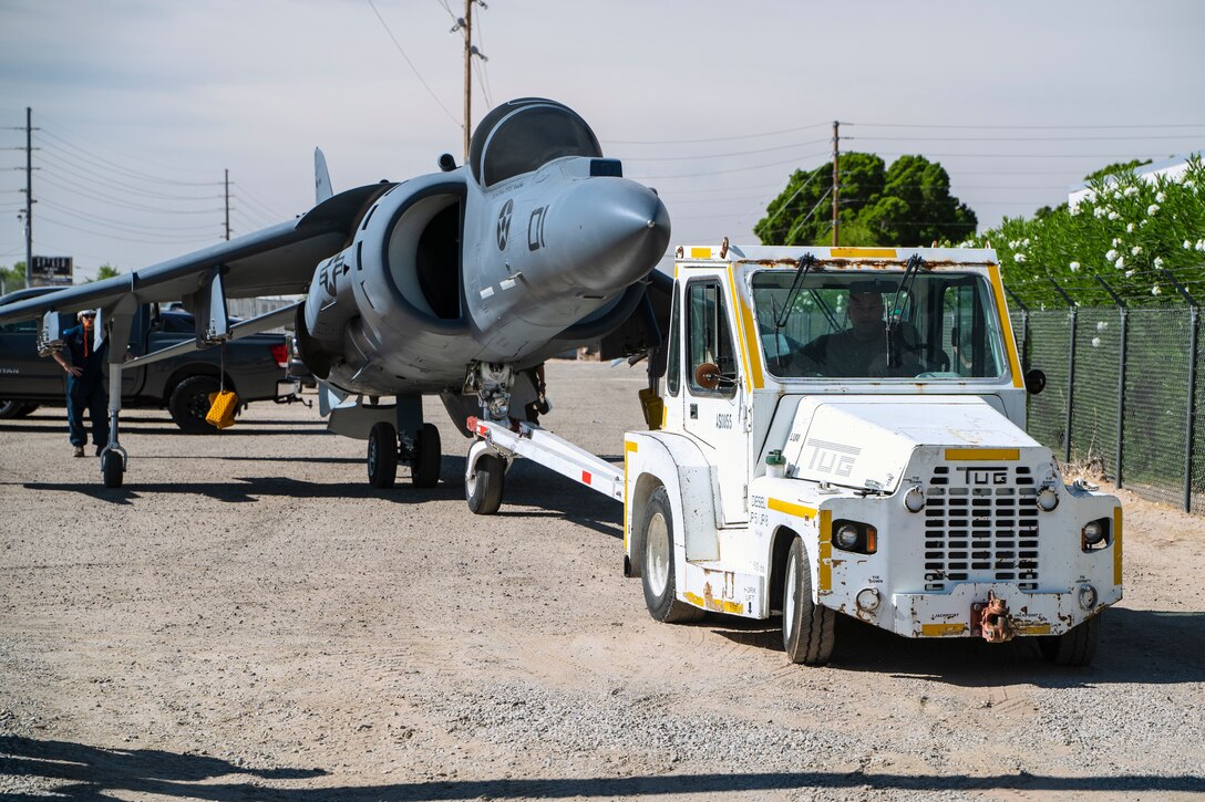 An AV-8B Harrier jet is transported across Marine Corps Air Station Yuma, June 7, 2021.