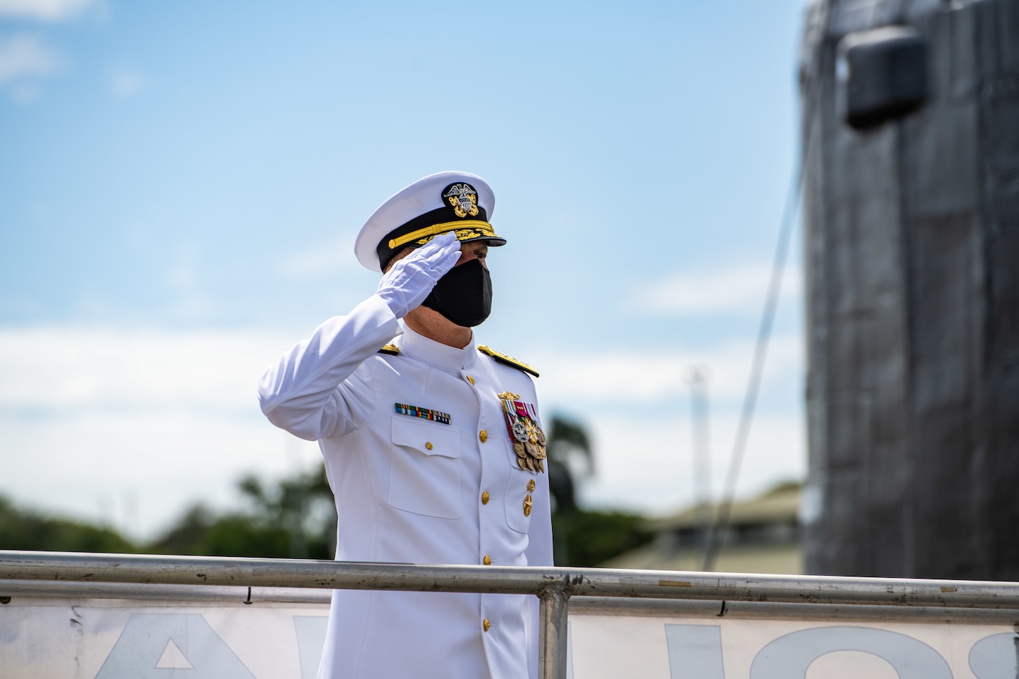 JOINT BASE PEARL HARBOR-HICKAM (April 29, 2021) -- Rear Adm. Jeffrey Jablon, from Frostburg, Maryland, salutes the ensign as he crosses the brow of the Virginia-class fast-attack submarine USS North Carolina (SSN 777) during the change of command ceremony for Commander, Submarine Force, U.S. Pacific Fleet. Jablon relieved Rear Adm. Blake Converse, from Montoursville, Pennsylvania, as the 43rd commander, Submarine Force, U.S. Pacific Fleet, at the ceremony held on the historic submarine piers on Joint Base Pearl Harbor-Hickam. (U.S. Navy photo by MC1 Michael B. Zingaro/Released)